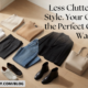 A minimalist capsule wardrobe flat lay on a light wood floor featuring a white shirt, sweaters, denim jeans, a black blazer, a beige tote bag, sneakers, and boots. Text reads, "Less Clutter. More Style. Your Guide to the Perfect Capsule Wardrobe."